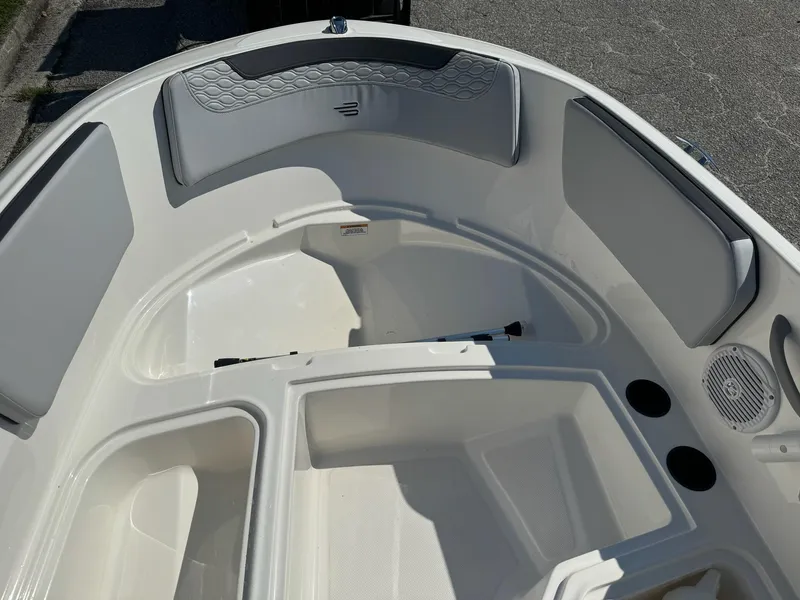 Slide: The Image of 2024 Bayliner Element M15 boat interior with seating and storage compartments. - 15