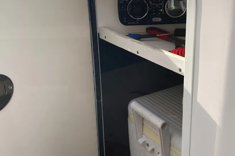 Slide: The Image of Interior storage compartment of 2012 Sea Ray 200 Sundeck boat. - 10