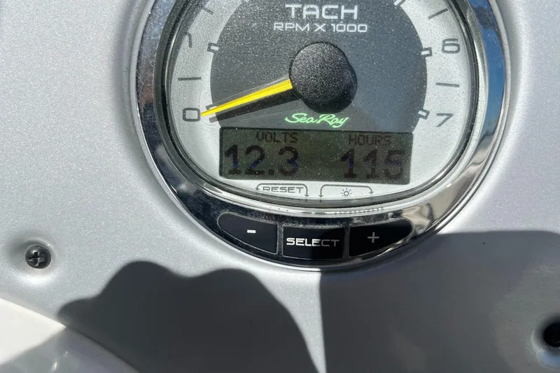 Slide: The Image of Tachometer of 2012 Sea Ray 200 Sundeck showing 12.3 volts and 115 hours. - 6