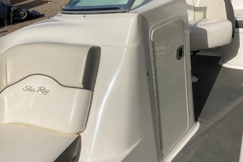 Slide: The Image of 2012 Sea Ray 200 Sundeck boat interior with seating and storage compartment. - 8