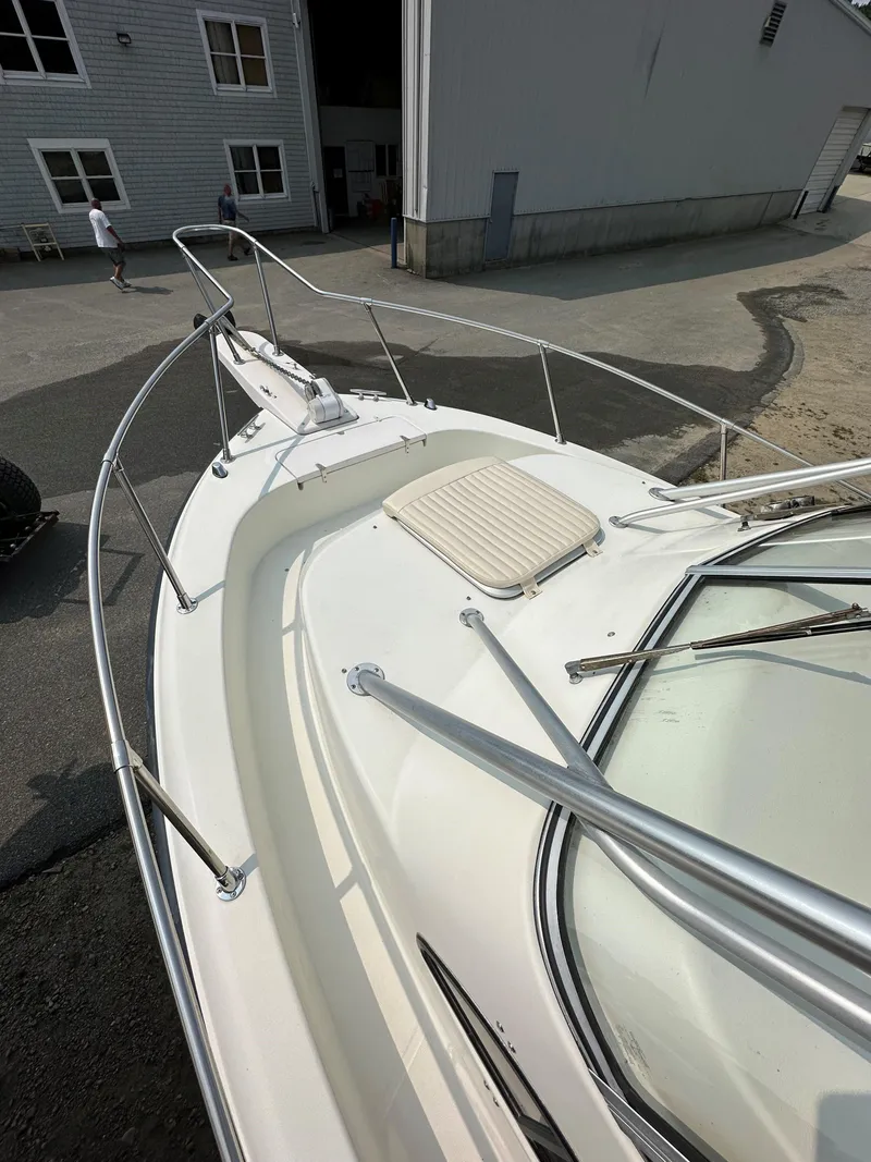 Slide: The Image of 2001 Grady-White 282 Sailfish boat deck with railing and cushioned seat. - 14