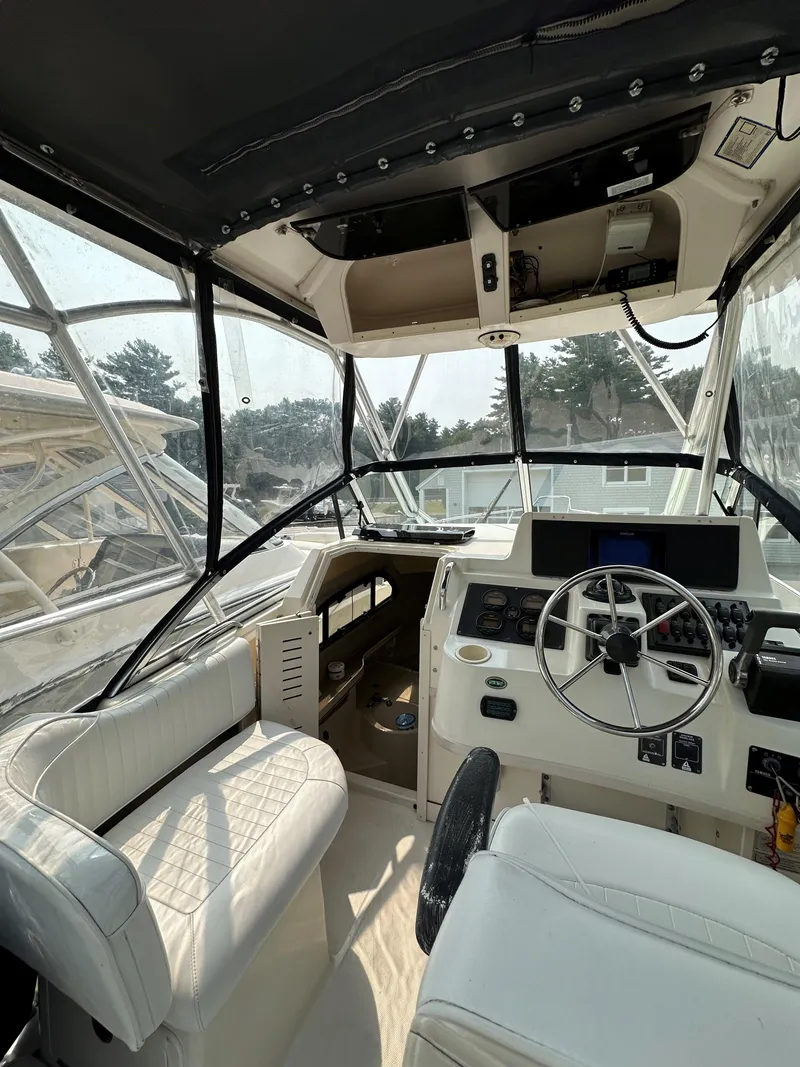 Slide: The Image of Interior of 2001 Grady-White 282 Sailfish boat with steering wheel and seating. - 3