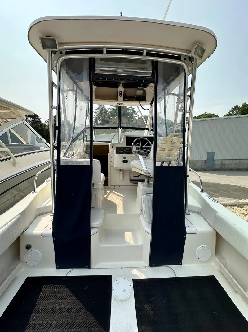 Slide: The Image of 2001 Grady-White 282 Sailfish boat interior with helm and seating area. - 6