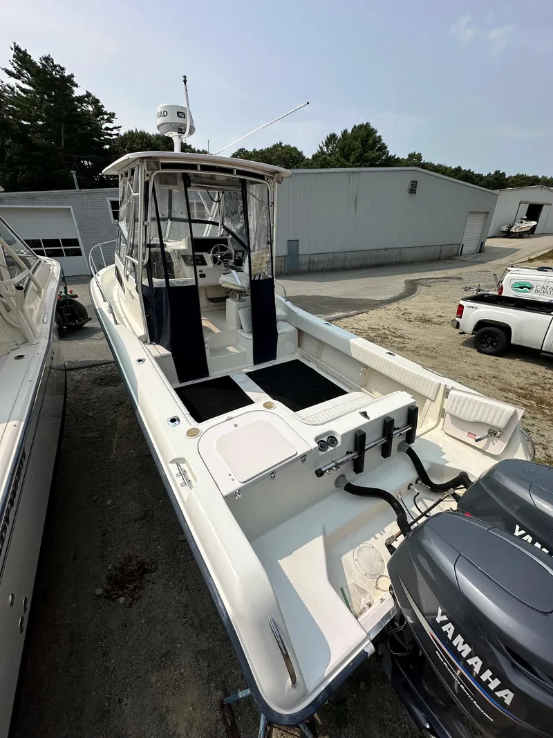 Slide: The Image of 2001 Grady-White 282 Sailfish boat with Yamaha engines, docked outdoors. - 8
