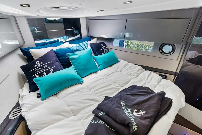 Slide: The Image of Luxurious cabin interior of 2022 Schaefer 400 Coupe with plush bedding and nautical decor. - 12