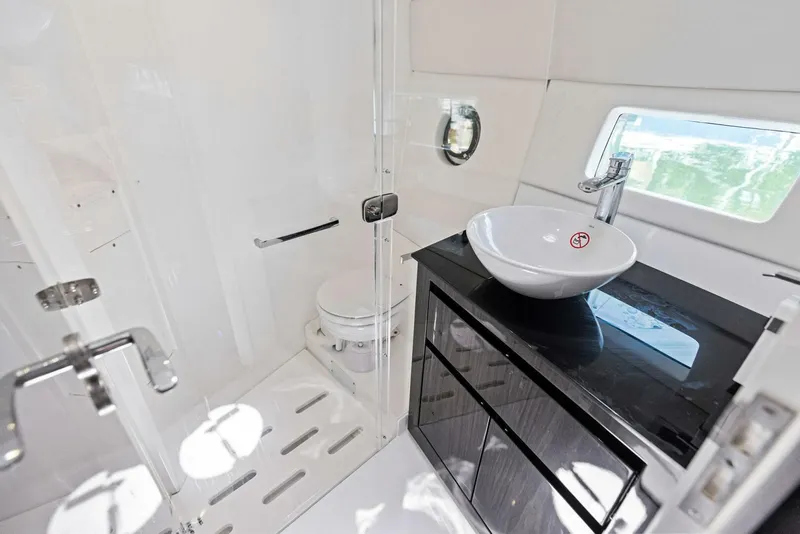 Slide: The Image of Luxurious bathroom in 2022 Schaefer 400 Coupe yacht with modern fixtures and sleek design. - 14