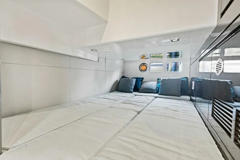 Slide: The Image of Luxurious interior cabin of 2022 Schaefer 400 Coupe yacht with plush bedding. - 18