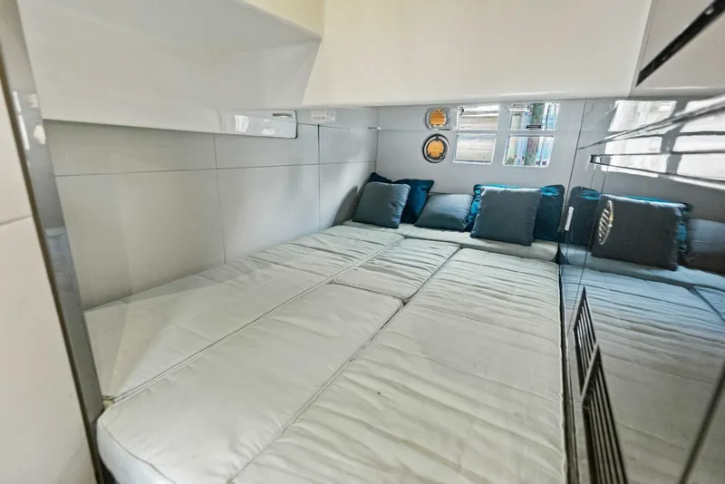 Slide: The Image of Luxurious cabin interior of 2022 Schaefer 400 Coupe yacht with plush bedding. - 19