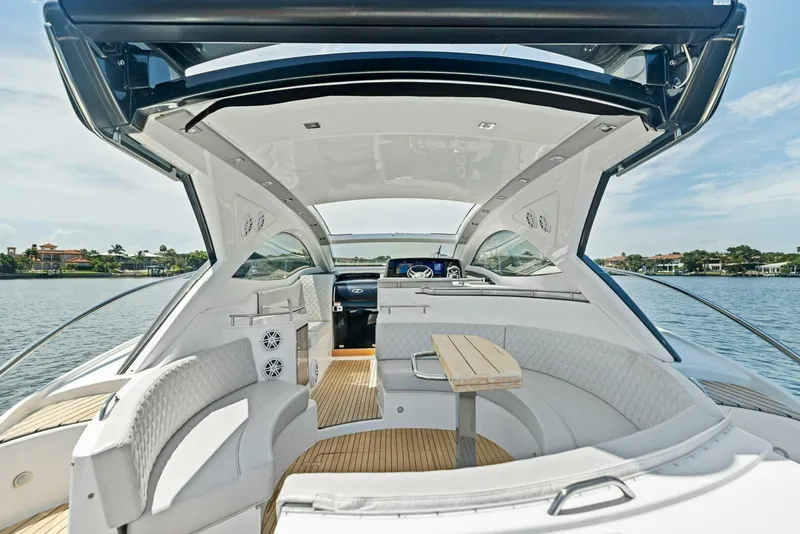 Slide: The Image of Interior of 2022 Schaefer 400 Coupe yacht with elegant seating and open roof design. - 24