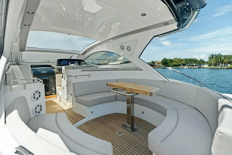 Slide: The Image of Luxurious 2022 Schaefer 400 Coupe yacht interior with elegant seating and scenic water view. - 25
