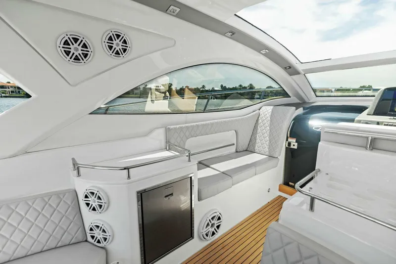Slide: The Image of Luxurious interior of 2022 Schaefer 400 Coupe yacht with modern seating and wood flooring. - 28