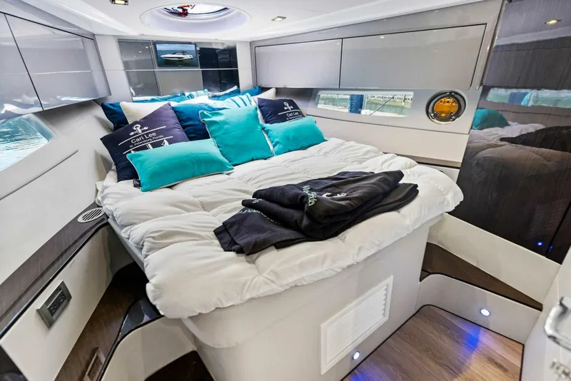 Slide: The Image of Luxurious interior of 2022 Schaefer 400 Coupe yacht with cozy bedding and modern design. - 3