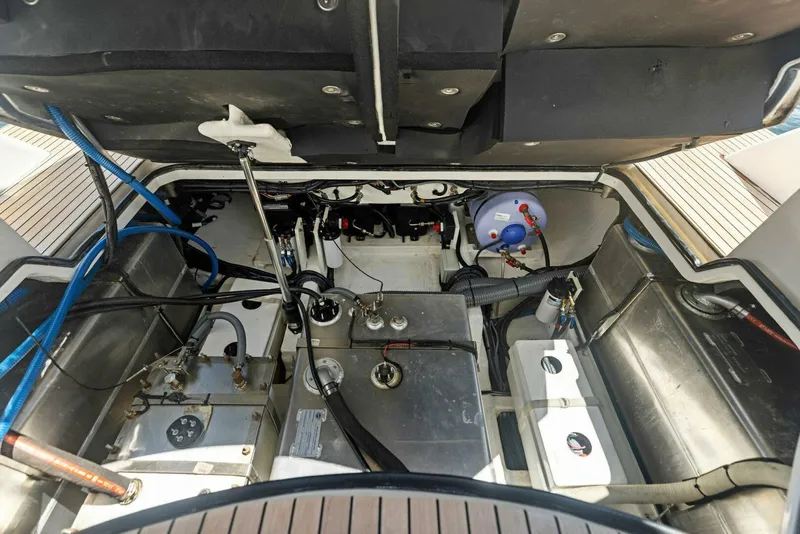Slide: The Image of Engine compartment of 2022 Schaefer 400 Coupe yacht, showcasing mechanical components and systems. - 33