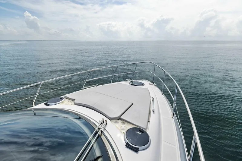 Slide: The Image of Schaefer 400 Coupe 2022 yacht cruising on calm ocean waters. - 34