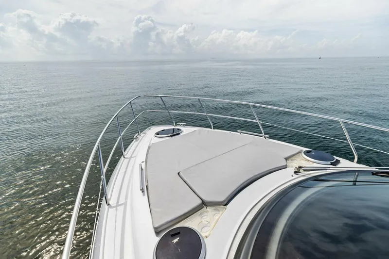 Slide: The Image of Schaefer 400 Coupe 2022 yacht cruising on calm ocean waters. - 35