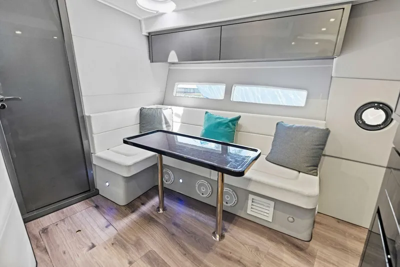 Slide: The Image of Modern interior of 2022 Schaefer 400 Coupe yacht with sleek seating and table. - 4