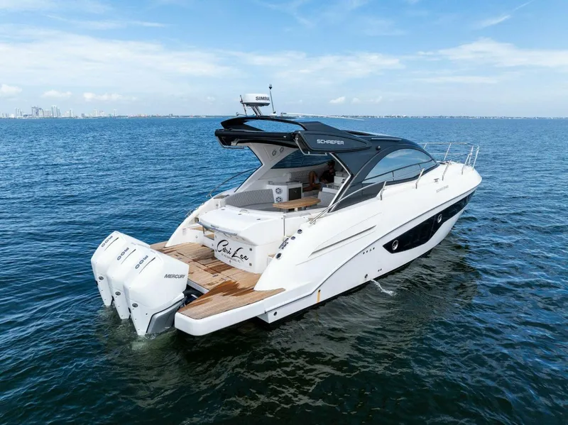 Slide: The Image of 2022 Schaefer 400 Coupe yacht cruising on open water. - 40