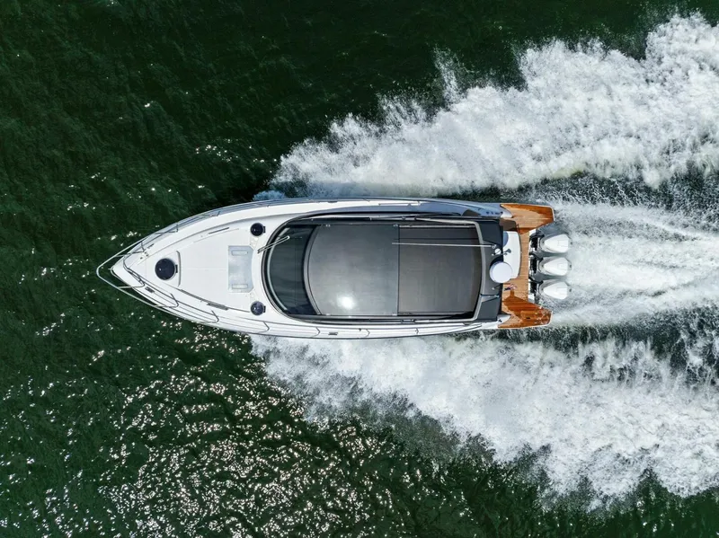 Slide: The Image of Aerial view of 2022 Schaefer 400 Coupe yacht cruising on water. - 44