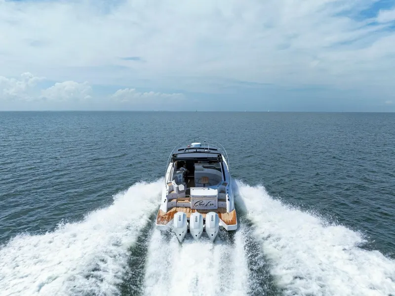 Slide: The Image of 2022 Schaefer 400 Coupe cruising on open water, rear view. - 47
