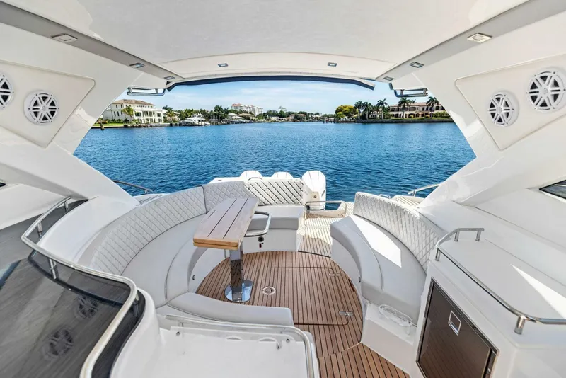Slide: The Image of Luxurious 2022 Schaefer 400 Coupe yacht interior with waterfront view. - 6