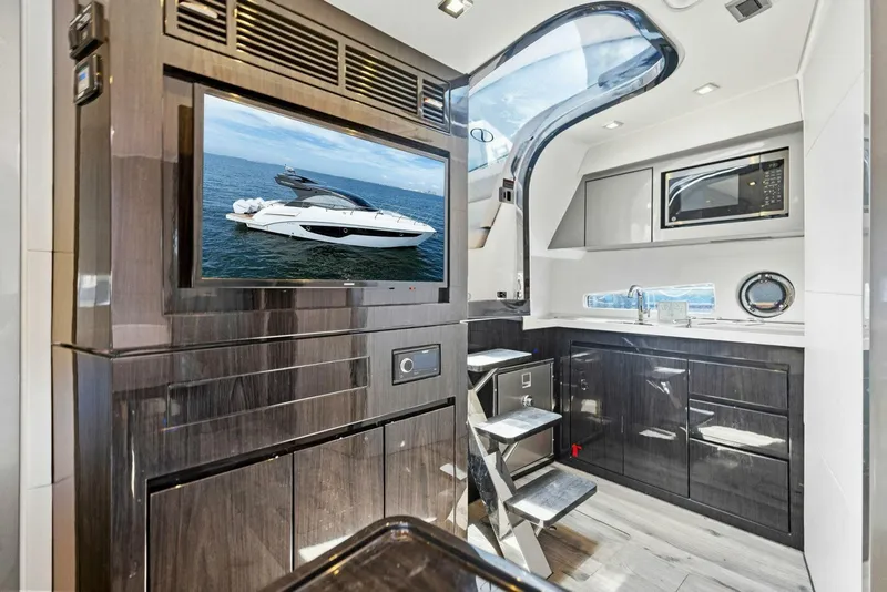 Slide: The Image of Luxurious interior of 2022 Schaefer 400 Coupe yacht with modern amenities and sleek design. - 7