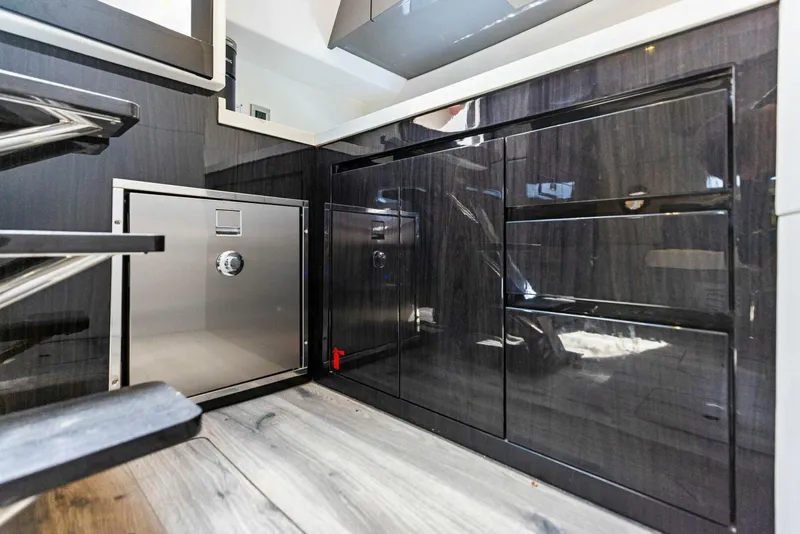 Slide: The Image of Modern kitchen interior of 2022 Schaefer 400 Coupe yacht with sleek cabinetry and stainless steel appliances. - 8