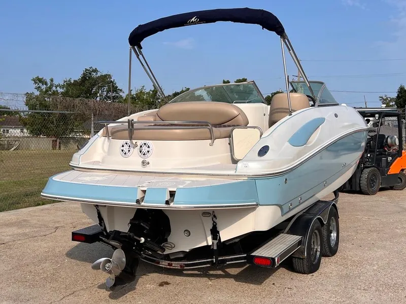 Slide: The Image of 2005 Monterey 220 Explorer Sport boat on trailer, blue and white exterior. - 3