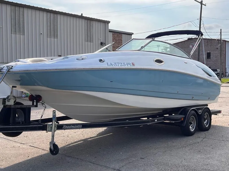 Slide: The Image of 2005 Monterey 220 Explorer Sport boat on trailer, parked outdoors. - 5