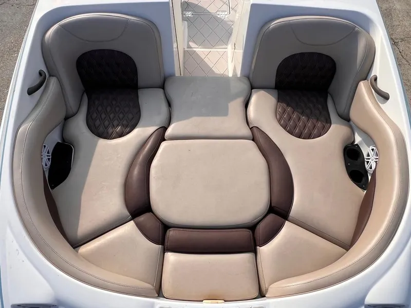 Slide: The Image of 2005 Monterey 220 Explorer Sport boat seating area with cushioned upholstery. - 7