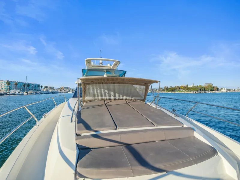 Slide: The Image of Prestige 680 yacht, 2018 model, cruising on a sunny day with clear blue skies. - 19