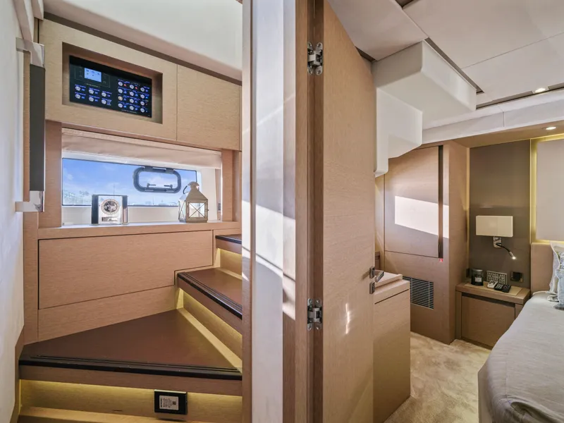 Slide: The Image of Interior of 2018 Prestige 680 yacht, featuring modern design and luxurious wood finishes. - 30