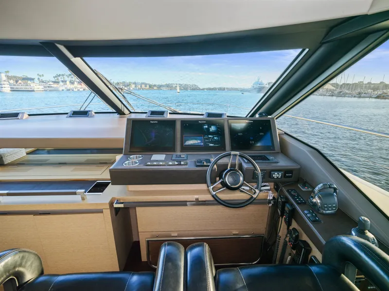 Slide: The Image of Prestige 680 yacht helm, 2018 model, featuring modern navigation systems and panoramic sea view. - 34