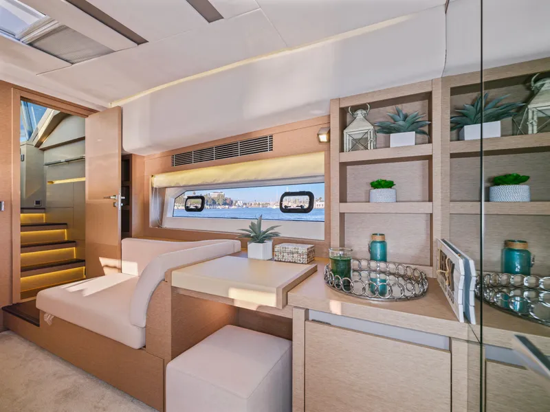 Slide: The Image of Luxurious interior of 2018 Prestige 680 yacht with modern decor and scenic window view. - 35