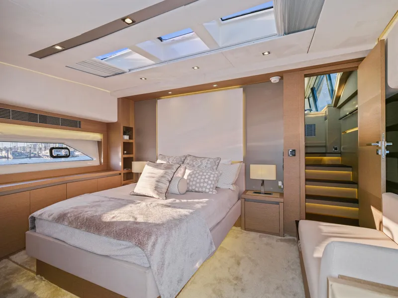 Slide: The Image of Luxurious bedroom interior of 2018 Prestige 680 yacht with modern design and skylights. - 36