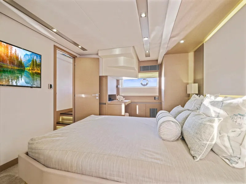Slide: The Image of Luxurious bedroom interior of 2018 Prestige 680 yacht with modern decor and scenic artwork. - 42