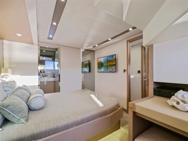 Slide: The Image of Luxurious bedroom interior of 2018 Prestige 680 yacht with modern decor and ambient lighting. - 43