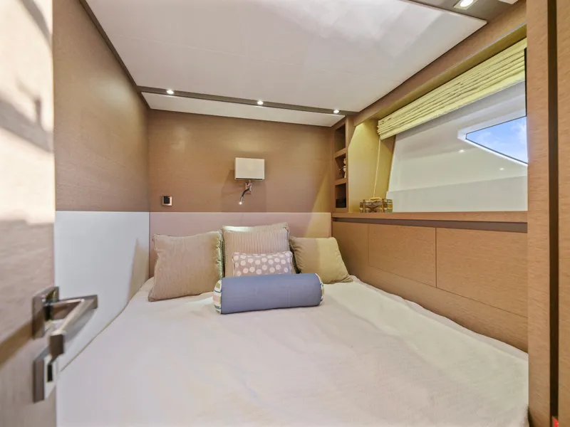 Slide: The Image of Luxurious bedroom interior of 2018 Prestige 680 yacht with modern decor and cozy bedding. - 44