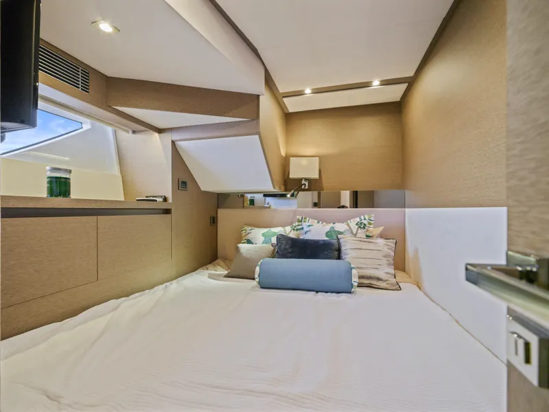 Slide: The Image of Luxurious bedroom interior of 2018 Prestige 680 yacht with modern design and cozy bedding. - 45