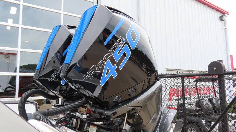 Slide: The Image of Twin Mercury Racing 450 outboard engines on a 2023 Sunsation 32 CCX boat. - 10