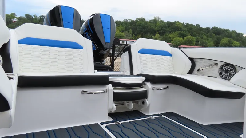 Slide: The Image of 2023 Sunsation 32 CCX boat interior with blue and white seating, dual engines. - 13