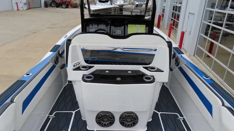 Slide: The Image of 2023 Sunsation 32 CCX boat interior with modern dashboard and seating. - 16