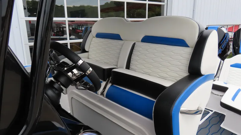 Slide: The Image of 2023 Sunsation 32 CCX boat interior with blue and white seating. - 18