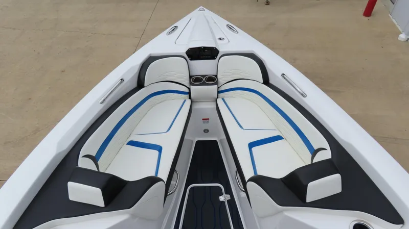Slide: The Image of 2023 Sunsation 32 CCX boat interior with white and blue seating. - 21