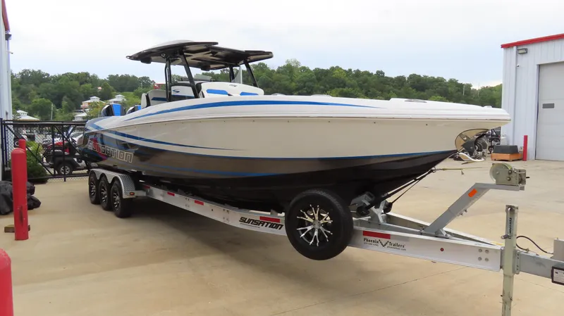 Slide: The Image of 2023 Sunsation 32 CCX boat on trailer, parked outdoors. - 5