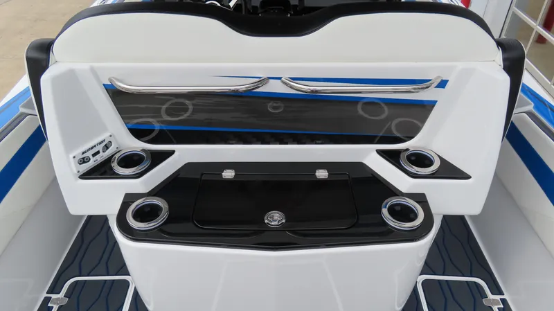 Slide: The Image of 2023 Sunsation 32 CCX boat interior with sleek design and cup holders. - 7