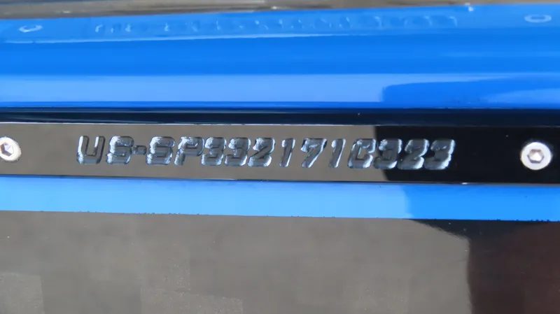 Slide: The Image of 2023 Sunsation 32 CCX boat identification number on blue and black surface. - 8