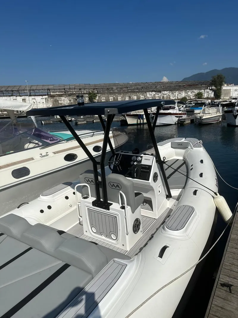 Slide: The Image of 2025 Aqvaboats Luxrib 25 docked in marina under clear blue sky. - 10