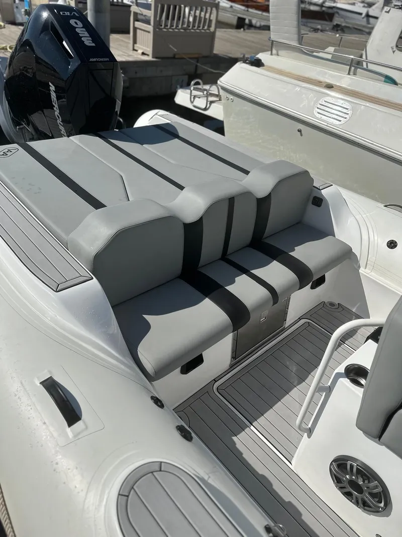Slide: The Image of Aqvaboats Luxrib 25, 2025 model, featuring sleek gray seating and modern design. - 12