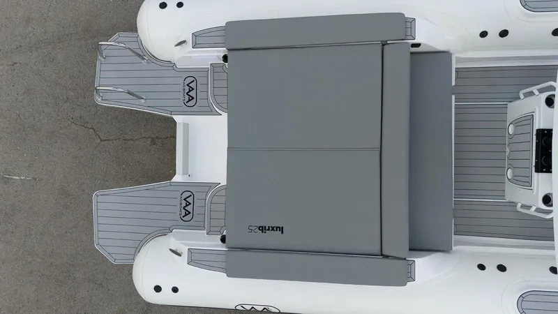 Slide: The Image of Aerial view of 2025 Aqvaboats Luxrib 25 with gray seating and deck. - 5
