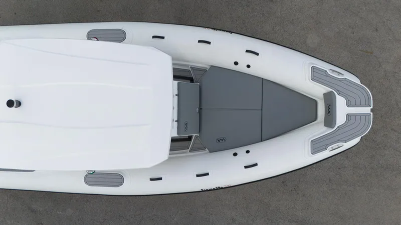 Slide: The Image of Aerial view of 2025 Aqvaboats Luxrib 25, sleek white and gray design. - 6